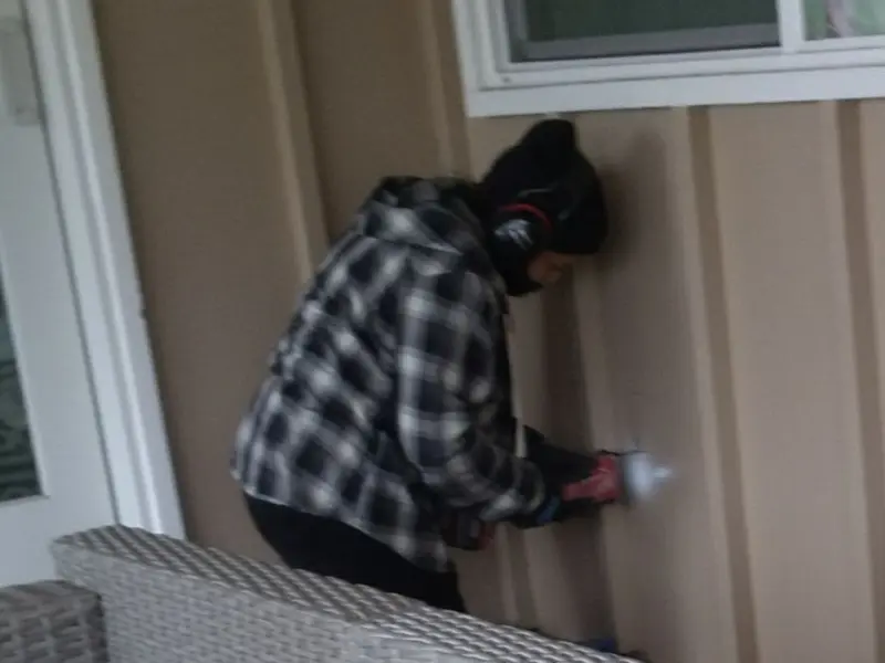 Professional electrician installing an exterior outlet in Arabi