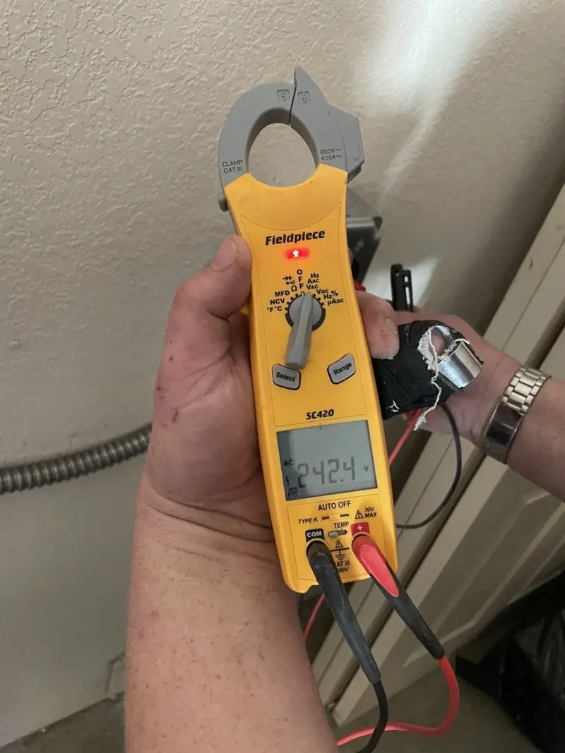 Voltage testing with clamp meter during Ceiling Fan Installation in Arabi